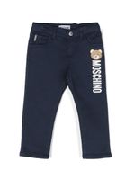 Moschino Kids pantalon droit à logo imprimé - Bleu