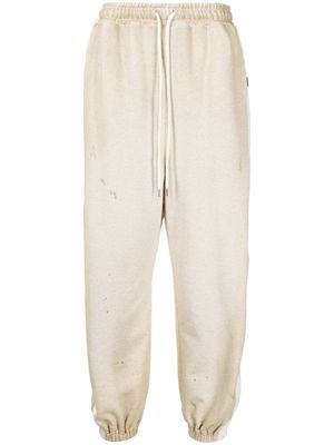 Maison MIHARA YASUHIRO pantalon de jogging à détails rayés - Tons neutres