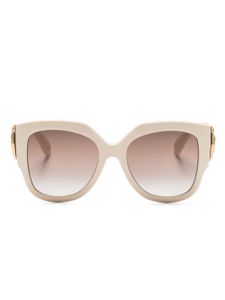 Gucci Eyewear lunettes de soleil rondes à plaque logo - Tons neutres