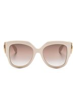 Gucci Eyewear lunettes de soleil rondes à plaque logo - Tons neutres