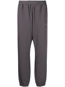 izzue pantalon de jogging à logo brodé - Gris