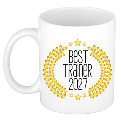 Cadeau koffie/thee mok - de beste trainer van 2027 - wit - 300 ml - keramiek