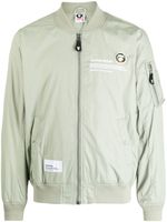 AAPE BY *A BATHING APE® veste bomber à slogan imprimé - Vert