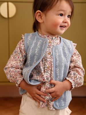 Mouwloos baby vestje denim bloemen stone Mouwloos baby vestje denim bloemen stone