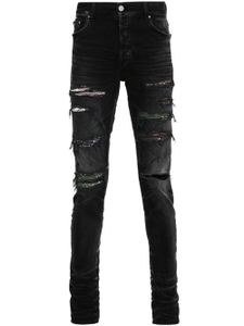 AMIRI jean skinny à effet usé - Noir