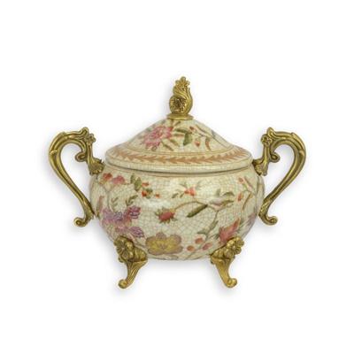 A BRONZE MOUNTED PORCELAIN SUGAR POT