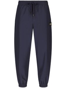 Dolce & Gabbana pantalon de jogging à plaque logo - Bleu