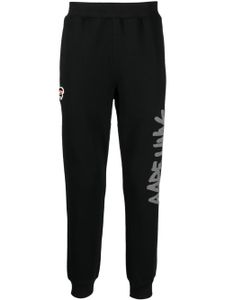 AAPE BY *A BATHING APE® pantalon de jogging fuselé à logo imprimé - Noir