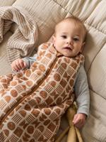 Omkeerbare mouwloze slaapzak met opening in het midden ETHNIC beige, bedrukt