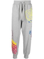 Dolce & Gabbana pantalon de jogging à imprimé graffiti - Gris