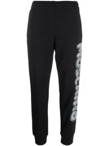 Moschino pantalon de jogging à logo imprimé - Noir