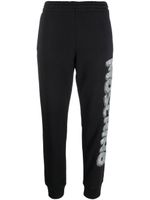 Moschino pantalon de jogging à logo imprimé - Noir