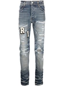 AMIRI jean skinny à effet usé - Bleu