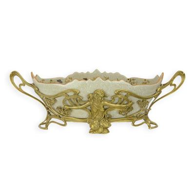 A BRONZE MOUNTED PORCELAIN PLANTER