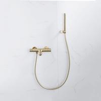 Fortifura Calvi Thermostatische badkraan met staafhanddouche, handdouchehouder en gladde doucheslang Geborsteld Messing PVD (Goud) SW720570/SW720567/SW720226/SW728176