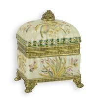 A BRASS MOUNTED PORCELAIN BOX AND COVER