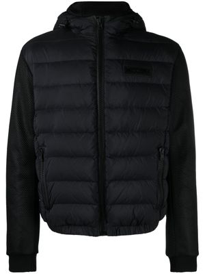 Moschino surchemise zippée à logo texturé - Noir