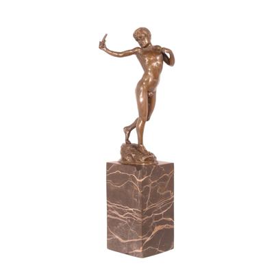 A BRONZE SCULPTURE OF A BOY WITH SLINGSHOT