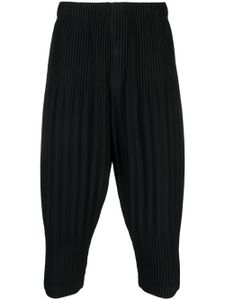 Homme Plissé Issey Miyake pantalon fuselé court à design plissé - Noir