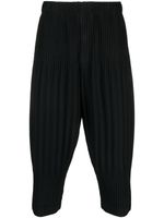 Homme Plissé Issey Miyake pantalon fuselé court à design plissé - Noir