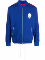 Alexander McQueen veste de sport à patch tête de mort - Bleu Alexander McQueen veste de sport à patch tête de mort - Bleu