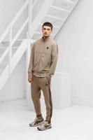 XPLCT Creator Trainingspak Heren Beige - Maat M - Kleur: Beige | Soccerfanshop