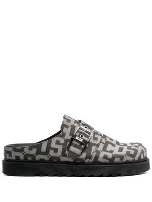 GCDS mules à motif monogrammé - Noir
