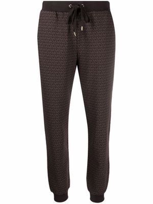 Michael Kors pantalon de jogging à motif monogrammé - Marron