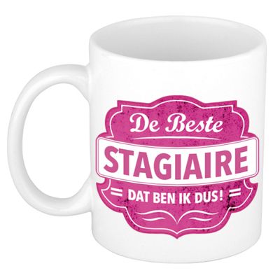 De beste stagiaire dat ben ik cadeau mok / beker wit met roze embleem 300 ml