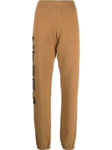 Heron Preston pantalon de jogging à logo imprimé - Marron