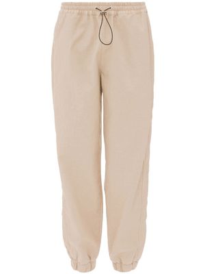 JW Anderson pantalon de jogging à coupe fuselée - Tons neutres