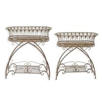 A PAIR OF BROWN IRON PLANTERS ON STAND A PAIR OF BROWN IRON PLANTERS ON STAND