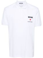 Moschino polo à slogan brodé - Blanc