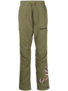 Maharishi pantalon de jogging à motif tigre - Vert