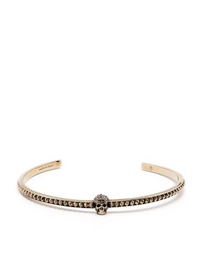 Alexander McQueen bracelet torque à breloque tête de mort