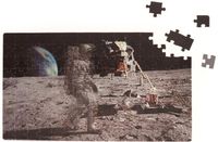 Kikkerland puzzel Motion Moonwalk 24 x 42 cm karton 135-delig - thumbnail