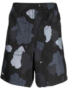 izzue short de sport à imprimé graphique - Noir