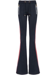 Balmain pantalon évasé à détails rayés - Bleu