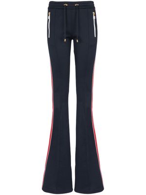 Balmain pantalon évasé à détails rayés - Bleu
