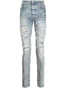 AMIRI jean skinny à effet usé - Bleu