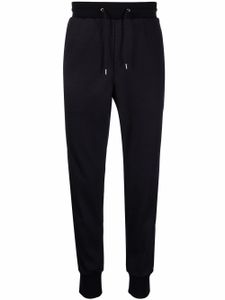 Paul Smith pantalon de jogging fuselé à rayures latérales - Bleu