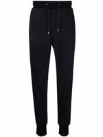 Paul Smith pantalon de jogging fuselé à rayures latérales - Bleu