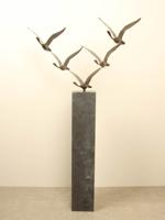 5 bronzen zwanen