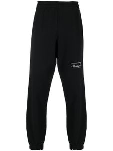 Martine Rose pantalon de jogging à logo imprimé - Noir