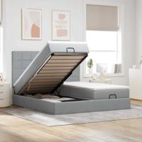Ottoman bed met matrassen en LED's 180x200cm stof lichtgrijs