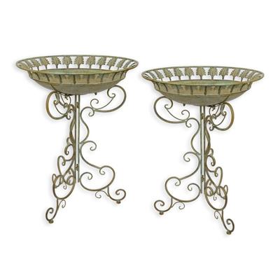 A PAIR OF IRON BIRD BATHS ON STAND