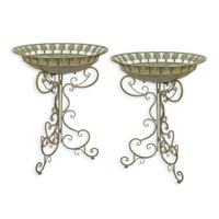A PAIR OF IRON BIRD BATHS ON STAND A PAIR OF IRON BIRD BATHS ON STAND