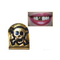Gouden tand met doodshoofd - piraat - carnaval artikel - plastic Gouden tand met doodshoofd - piraat - carnaval artikel - plastic