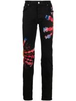 AMIRI jean skinny à imprimé tie dye - Noir